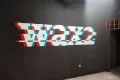 Tlač logo na stenu v klube Wax2